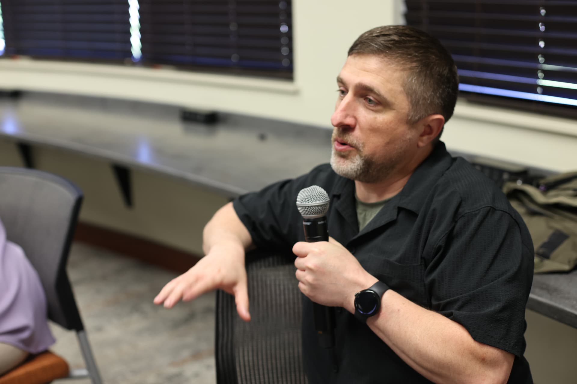 A community speaker sharing an idea during a meetup